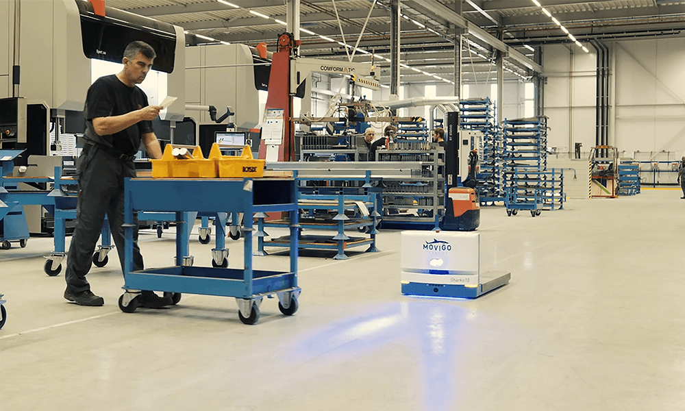 Sharko10 industrial pallet amr agv autonomous mobile robot stops on factory floor for man safety systems