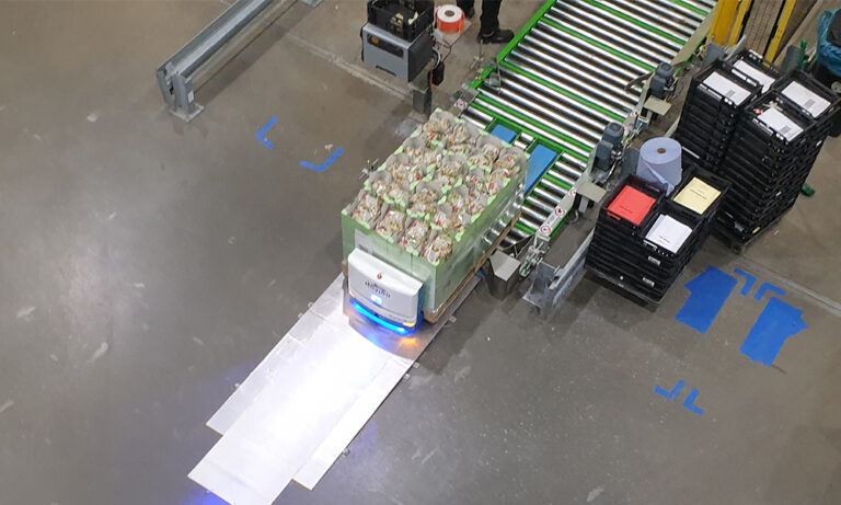 Industry 4.0 AMR AGV Sharko10 Pallet Robot collects pallet from conveyor line